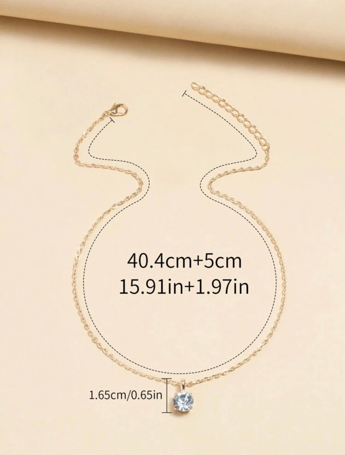 Sparkling gold necklace with diamanté pendant