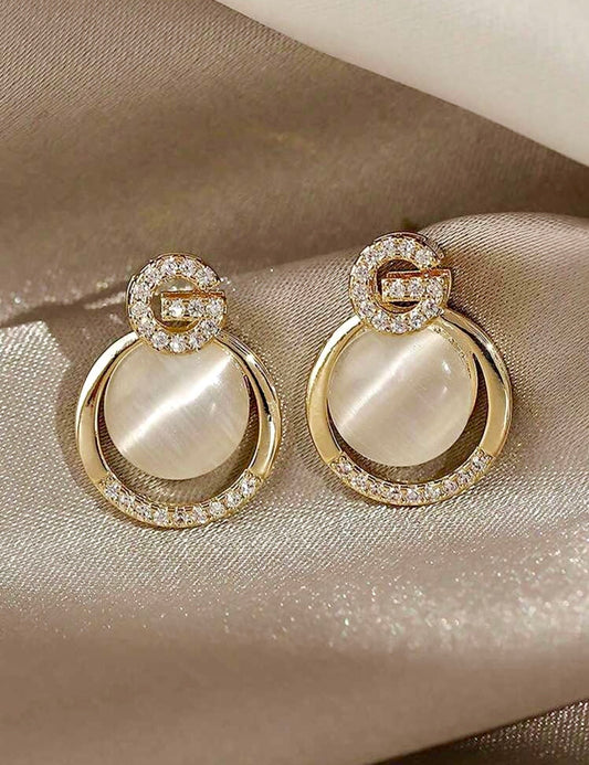 Cat eye stone G earrings