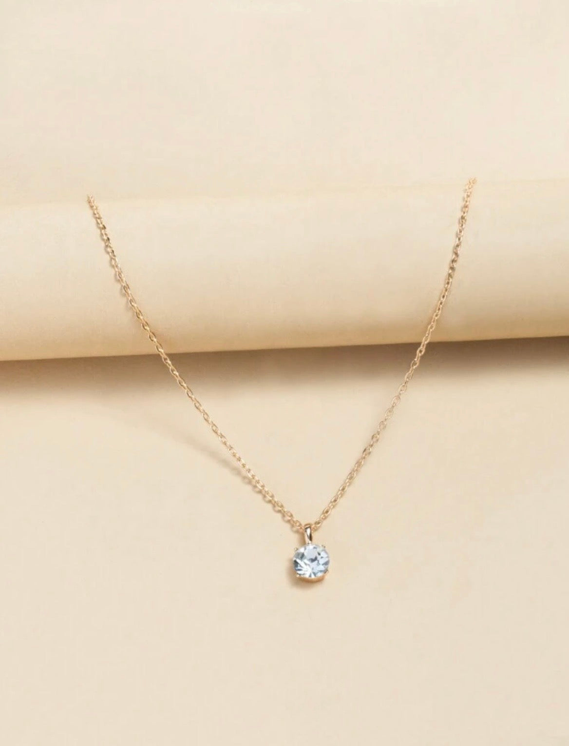 Sparkling gold necklace with diamanté pendant
