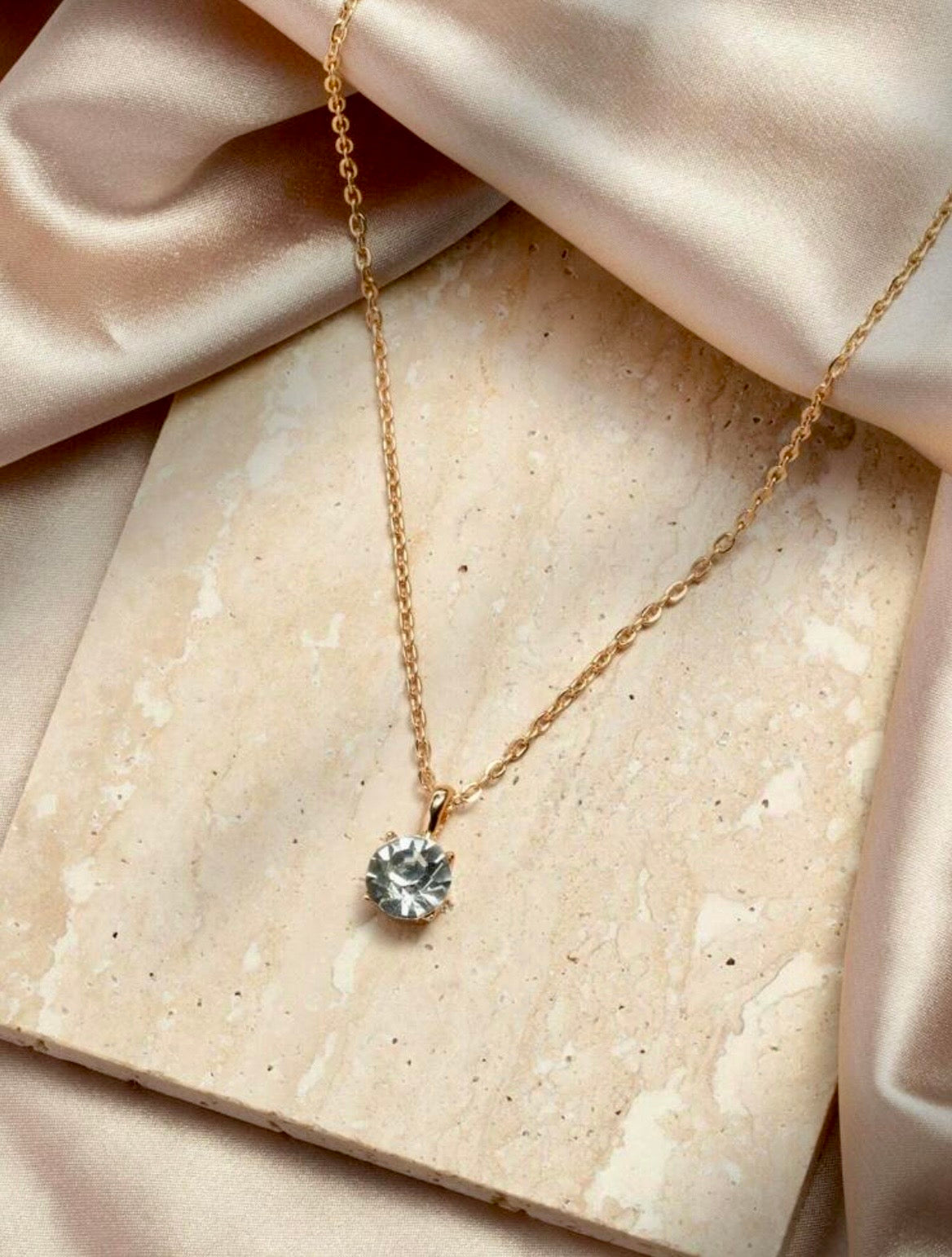 Sparkling gold necklace with diamanté pendant